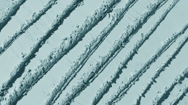 Pale Cyan Powder Surface with Intersecting Trails