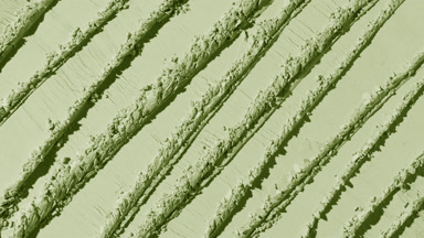 Shifting Shadows on Pale Green Powder with Knife Strokes