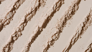Beige Powder Surface with Knife Marks and Dynamic Shadows