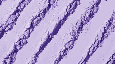 Violet Powder Surface with Parallel Knife Trails and Shadows