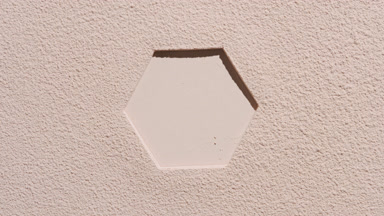 Dynamic Beige Powder Surface with Hexagonal Imprint