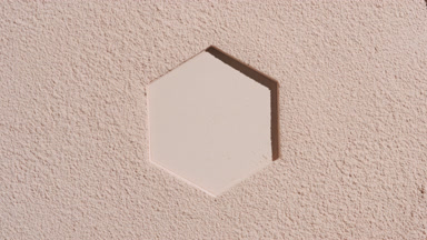 Fine-Textured Beige Powder with Hexagonal Imprint