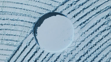 Pale Blue Powder Surface with Round Imprint and Shadows