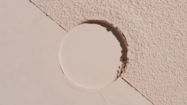 Moving Shadows on Beige Powder with Circular Impression