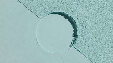 Dynamic Shadows on Pale Cyan Powder with Circular Mark