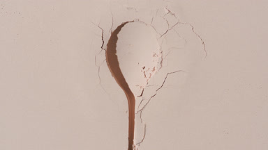 Beige Powder Surface with Spoon Imprint and Dynamic Shadows