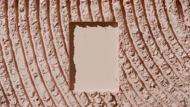 Beige Powder Furrows Surface with Rectangular Trace and Shadows