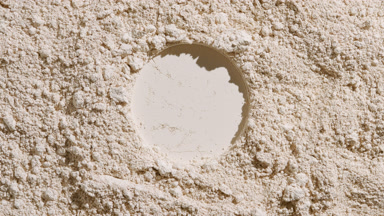 Beige Powder Surface with Round Indentation and Shadows