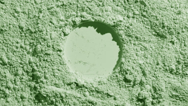 Pale Green Powder Surface with Circular Imprint and Shadows