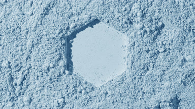 Pale Blue Powder Surface with Hexagonal Imprint and Shadows