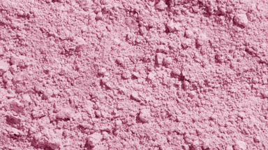 Shifting Shadows on Light Pink Loose Powder Surface