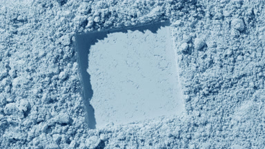 Pale Blue Powder Surface with Square Imprint and Shadows