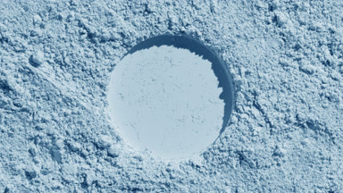 Pale Blue Powder Surface with Round Imprint and Shadows