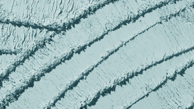 Pale Cyan Powder Surface with Intersecting Trails and Shadows