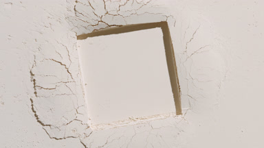 Beige Powder Surface with Square Imprint and Changing Shadows