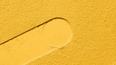Fluid Yellow Powder Surface with Circle Imprint