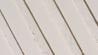 Beige Powder Surface with Striped Imprints and Shadows