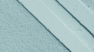 Pale Cyan Powder with Striped Imprints and Dynamic Shadows