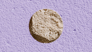 Beige Powder Texture Through Pale Violet Sifted Surface