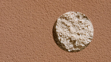Beige Powder Texture Revealed Beneath Brown Sifted Surface