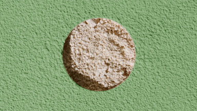 Beige Powder Revealed Through Green Coated Surface Hole