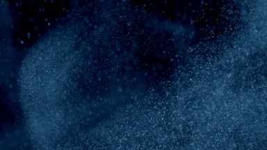 Soft Blue Dust Motion on Dark Backdrop
