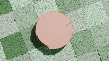 Beige Powder Casting Shadow on Green Mosaic Surface
