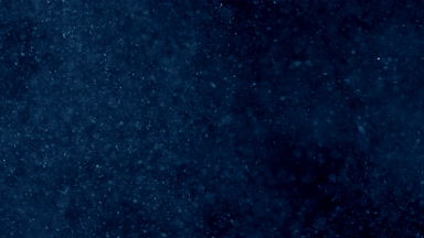 Drifting Blue Dust Cloud on Black Background