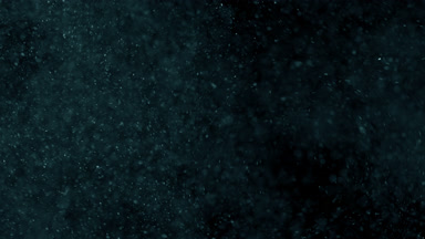 Cyan Dust Motion on Dark Background