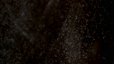 Drifting White Dust Cloud on Black Background