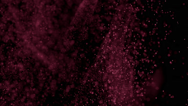 Floating Red Powder Dust on Black Background