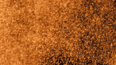 Soft Yellow Dust Motion on Dark Background