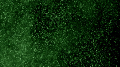 Floating Green Powder Dust on Black Background