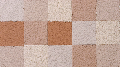 Slow-Motion Drop Creating Ripples Over Beige and Brown Powder