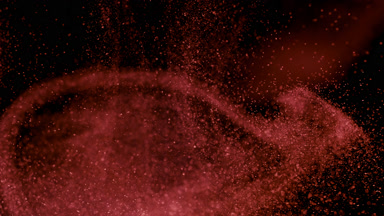 Drifting Red Dust Cloud on a Black Background