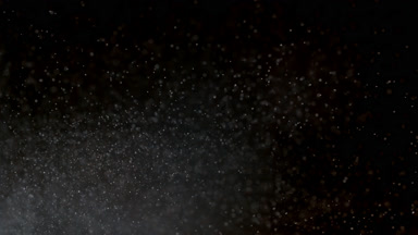 Drifting White Dust Cloud on Dark Background