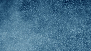 Soft Blue Dust Motion on Dark Backdrop