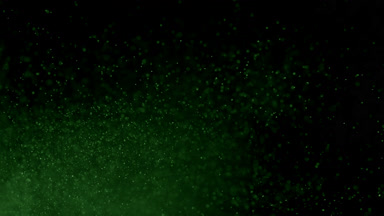 Drifting Green Dust Cloud on Dark Background