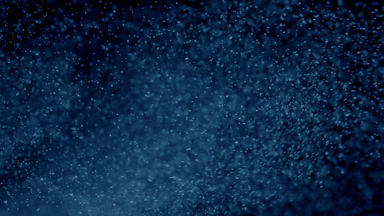 Floating Blue Powder Dust on Black Background