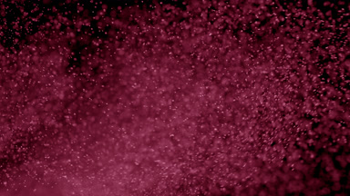 Drifting Pink Dust Cloud on Dark Background