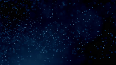 Suspended Blue Dust Creating Atmosphere on Dark Background