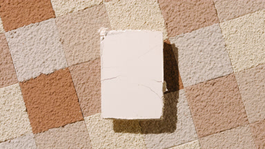 Beige Pressed Powder with Skin Tone Mosaic Background