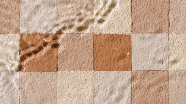 Slow-Motion Water Flow on Beige and Brown Mosaic Surface