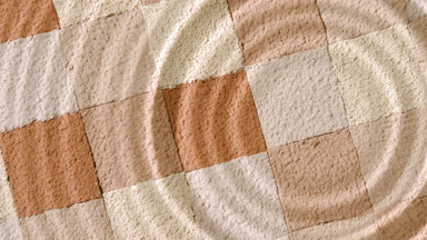 Concentric Ripples from Drop on Beige and Brown Mosaic