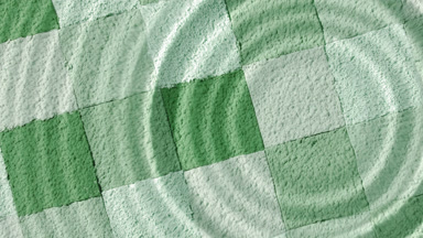 Slow-Motion Water Drop Creating Ripples Over Green Mosaic