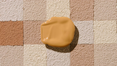 Beige Foundation Blob with Shadow on Brown Mosaic Background