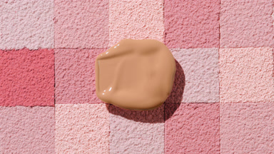Soft Beige Foundation Smear on Pink Mosaic Background