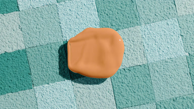 Soft Foundation Smear on Cyan Mosaic Background