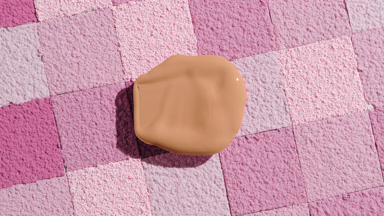 Beige Foundation Blob with Shadow on Pink Mosaic Surface
