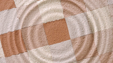 Concentric Ripples from Drop on Water Surface with Powder
